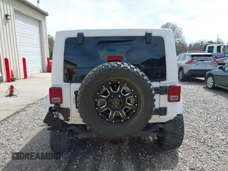 2017 Jeep Wrangler Unlimited Sahara with VIN 1C4BJWEG8HL734572, listed as a IAAI auction lot 41863636 with 123,979 mi miles. Bid and sale history available at carsss.com. Image 17.