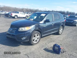 2012 Hyundai Santa Fe Limited z VIN 5XYZKDAG3CG130695, wystawiony jako IAAI lot #41880175 z przebiegiem 152 727 mil mil oraz . Historia ofert i sprzedaży dostępna na DreamBid. Obrazek 2.