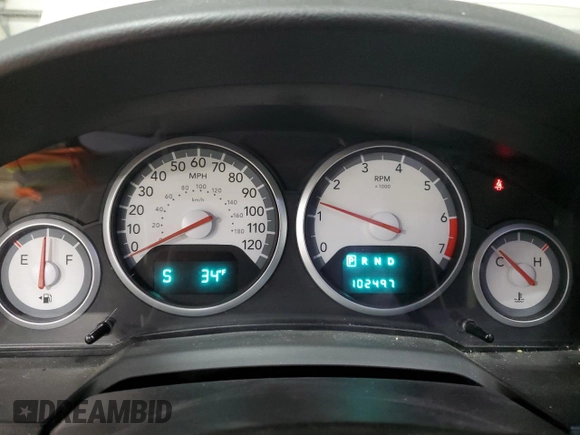 2010 Dodge Grand Caravan Crew with VIN 2D4RN6DX7AR463122, listed as a Copart auction lot 48768635 with 102,497 mi miles and Salvage Title. Bid and sale history available at DreamBid. Image 9.