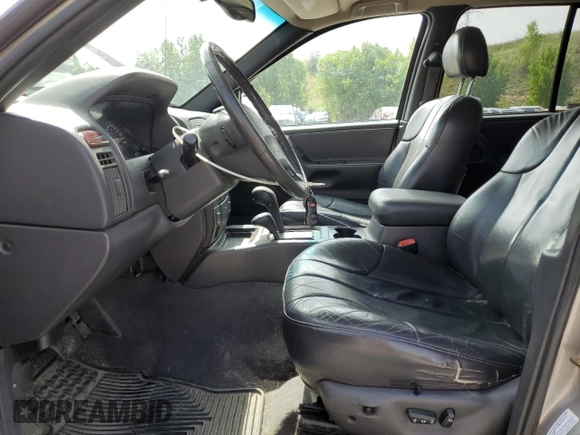 2000 Jeep Grand Cherokee Laredo with VIN 1J4GW48N1YC324356, listed as a Copart auction lot 62011305 with 242,322 mi miles and Salvage title. Bid and sale history available at DreamBid. Image 7.