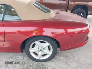 1997 Jaguar XK with VIN SAJGX274XVC004952, listed as a IAAI auction lot 42211023 with 109,889 mi miles and . Bid and sale history available at DreamBid. Image 6.
