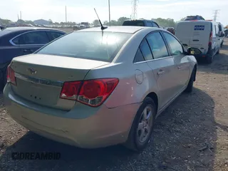 2014 Chevrolet Cruze 1LT with VIN 1G1PC5SB9E7180989, listed as a IAAI auction lot 42230408 with 112,927 mi miles and . Bid and sale history available at DreamBid. Image 4.