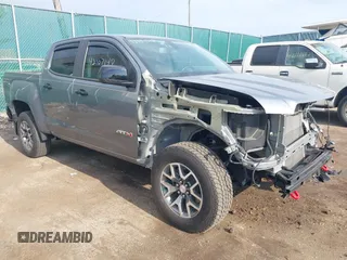 2022 GMC Canyon 4WD AT4 z VIN 1GTG6FEN2N1101756, wystawiony jako IAAI lot #42107148 z przebiegiem 37 900 mil mil oraz . Historia ofert i sprzedaży dostępna na DreamBid. Obrazek 1.