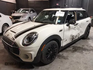 2023 MINI Clubman Cooper S with VIN WMWXJ1C02P2S77645, listed as a IAAI auction lot 41300674 with 34,302 mi miles. Bid and sale history available at carsss.com. Image 2.