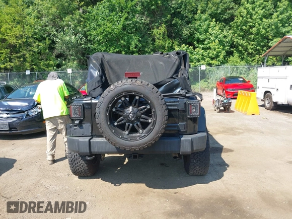 2015 Jeep Wrangler Unlimited Sport with VIN 1C4BJWDG2FL518487, listed as a IAAI auction lot 42593022 with 161,991 mi miles and . Bid and sale history available at DreamBid. Image 16.