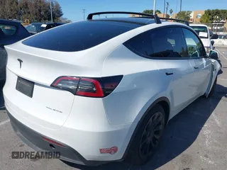 2023 Tesla Model Y Long Range with VIN 7SAYGDEEXPA152986, listed as a IAAI auction lot 41946665 with 13,574 mi miles and . Bid and sale history available at carsss.com. Image 4.