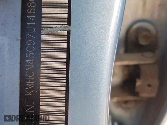 2007 Hyundai Accent GL z VIN KMHCN45C97U146808, wystawiony jako Copart lot #70781004 z przebiegiem Nie podano mil oraz Szkoda całkowita • Salvage title. Historia ofert i sprzedaży dostępna na DreamBid. Obrazek 12.