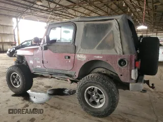 2003 Jeep Wrangler Sahara with VIN 1J4FA59S03P336844, listed as a Copart auction lot 49290345 with 167,726 mi miles and Salvage title. Bid and sale history available at DreamBid. Image 2.