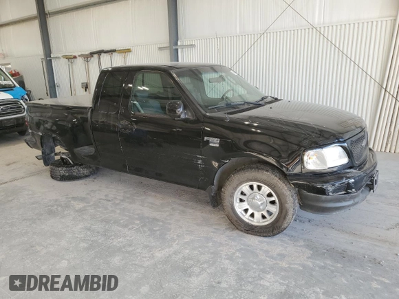 2002 Ford F-150 XL with VIN 2FTRX07W72CA71544, listed as a Copart auction lot 81628694 with 313,663 mi miles and Salvage title. Bid and sale history available at DreamBid. Image 4.