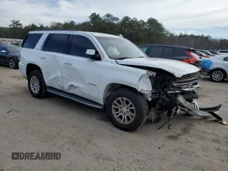2015 GMC Yukon SLE with VIN 1GKS2AKCXFR744083, listed as a Copart auction lot 82003234 with 150,926 mi miles and Salvage Title. Bid and sale history available at carsss.com. Image 4.