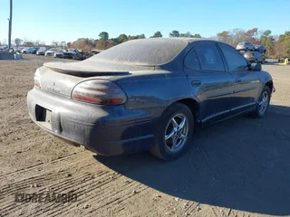 2002 Pontiac Grand Prix GT z VIN 1G2WP52K82F256389, wystawiony jako IAAI lot #40822299 z przebiegiem 178 940 mil mil oraz . Historia ofert i sprzedaży dostępna na DreamBid. Obrazek 4.