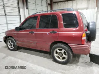 1999 Suzuki Vitara JX z VIN 2S3TD52V4X6110057, wystawiony jako Copart lot #87752215 z przebiegiem 245 419 mil mil oraz Szkody całkowita. Historia ofert i sprzedaży dostępna na DreamBid. Obrazek 2.