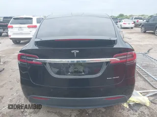 2021 Tesla Model X Long Range Plus with VIN 5YJXCAE27MF324270, listed as a IAAI auction lot 41886101 with 59,614 mi miles and . Bid and sale history available at carsss.com. Image 16.