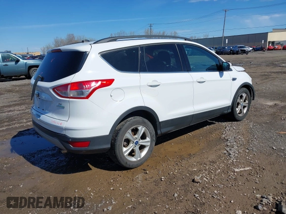 2014 Ford Escape SE with VIN 1FMCU0GX6EUA20379, listed as a IAAI auction lot 42082363 with 129,059 mi miles. Bid and sale history available at carsss.com. Image 4.