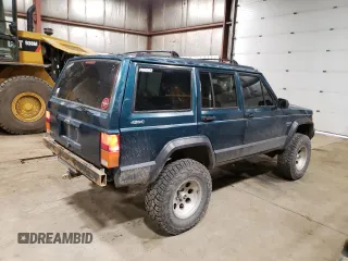 1996 Jeep Cherokee Sport with VIN 1J4FJ68S1TL226495, listed as a Copart auction lot 58587685 with 205,397 mi miles and Salvage title. Bid and sale history available at DreamBid. Image 3.
