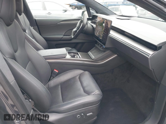 2022 Tesla Model X Plaid with VIN 7SAXCBE6XNF337687, listed as a IAAI auction lot 42035097 with 18,756 mi miles and . Bid and sale history available at DreamBid. Image 5.
