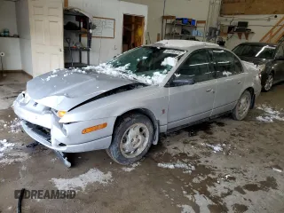 2001 Saturn SL z VIN 1G8ZK54791Z298951, wystawiony jako Copart lot #89198795 z przebiegiem 157 208 mil mil oraz Szkody całkowita. Historia ofert i sprzedaży dostępna na DreamBid. Obrazek 1.