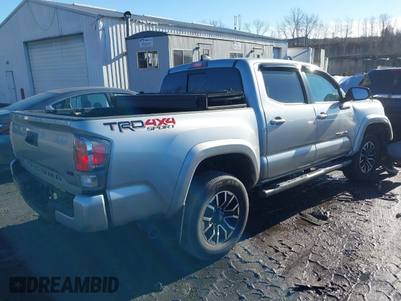 2023 Toyota Tacoma 4WD SR with VIN 3TMCZ5ANXPM543065, listed as a IAAI auction lot 41101092 with 33,792 mi miles. Bid and sale history available at carsss.com. Image 4.