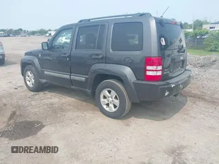 2011 Jeep Liberty Sport Jet z VIN 1J4PN2GK9BW592303, wystawiony jako IAAI lot #42475552 z przebiegiem 241 856 mil mil oraz . Historia ofert i sprzedaży dostępna na DreamBid. Obrazek 3.