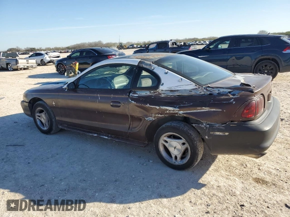1997 Ford Mustang with VIN 1FALP4043VF174092, listed as a Copart auction lot 86983884 with 105,774 mi miles and Salvage Title. Bid and sale history available at carsss.com. Image 2.