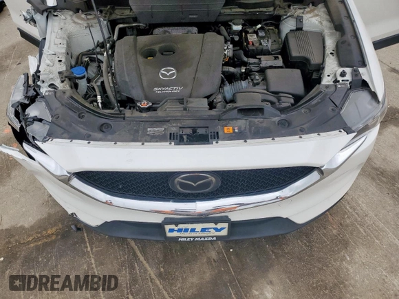 2018 Mazda CX-5 Touring z VIN JM3KFACM0J0469433, wystawiony jako Copart lot #54349955 z przebiegiem Nie podano mil oraz Szkoda całkowita • Salvage title. Historia ofert i sprzedaży dostępna na DreamBid. Obrazek 12.