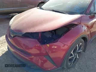 2018 Toyota C-HR XLE with VIN NMTKHMBX3JR059057, listed as a IAAI auction lot 41810801 with 124,246 mi miles. Bid and sale history available at carsss.com. Image 6.