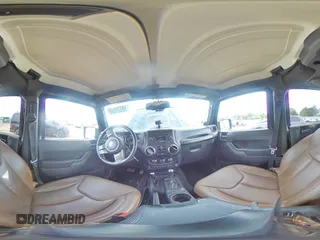 2013 Jeep Wrangler Unlimited Sahara with VIN 1C4BJWEG8DL584909, listed as a Copart auction lot 58520555 with 91,633 mi miles and Salvage title. Bid and sale history available at DreamBid. Image 14.