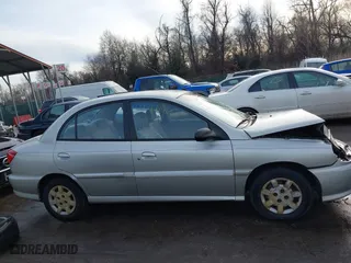 2001 Kia Rio with VIN KNADC123716042067, listed as a IAAI auction lot 41449479 with 113,108 mi miles. Bid and sale history available at carsss.com. Image 13.