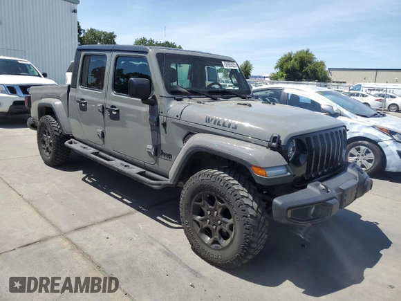 2023 Jeep Gladiator Sport S with VIN 1C6HJTAG3PL552959, listed as a Copart auction lot 56905635 with 30,356 mi miles and Salvage title. Bid and sale history available at DreamBid. Image 4.