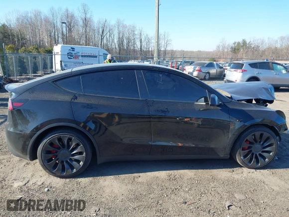 2022 Tesla Model Y Performance with VIN 7SAYGDEF0NF447460, listed as a IAAI auction lot 41670250 with 28,287 mi miles. Bid and sale history available at carsss.com. Image 14.