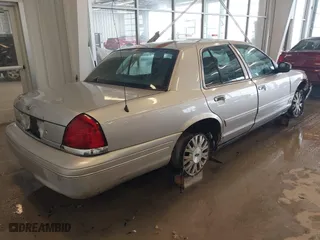 2005 Ford Crown Victoria LX with VIN 2FAFP74W95X158705, listed as a IAAI auction lot 41593553 with 276,940 mi miles. Bid and sale history available at carsss.com. Image 4.