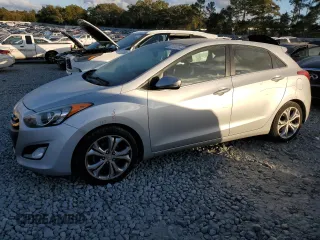 2013 Hyundai Elantra GT with VIN KMHD35LE7DU090495, listed as a Copart auction lot 77133264 with 118,660 mi miles and Salvage Title. Bid and sale history available at carsss.com. Image 1.