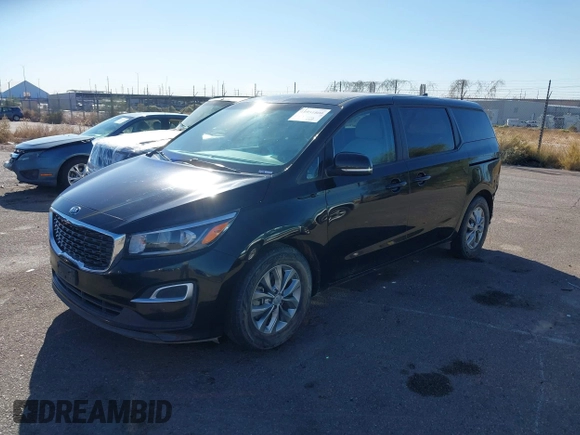 2020 Kia Sedona EX with VIN KNDMB5C11L6594029, listed as a IAAI auction lot 40951800 with 164,989 mi miles. Bid and sale history available at carsss.com. Image 2.