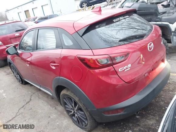 2018 Mazda CX-3 Grand Touring with VIN JM1DKFD75J0305565, listed as a IAAI auction lot 41135957 with 26,810 mi miles. Bid and sale history available at carsss.com. Image 3.
