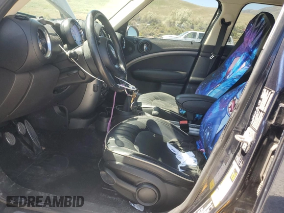 2013 MINI Countryman S ALL4 with VIN WMWZC5C50DWM15256, listed as a Copart auction lot 58080895 with 123,514 mi miles and Salvage title. Bid and sale history available at DreamBid. Image 7.