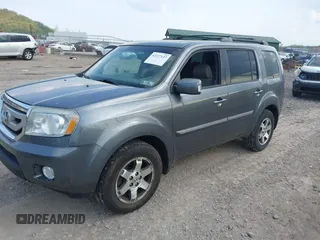 2011 Honda Pilot Touring with VIN 5FNYF4H90BB103824, listed as a IAAI auction lot 42127137 with 243,858 mi miles and . Bid and sale history available at carsss.com. Image 17.