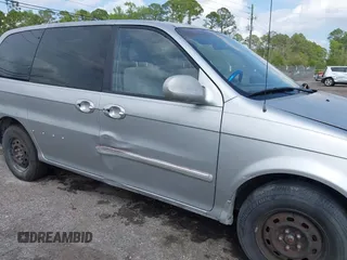 2003 Kia Sedona LX with VIN KNDUP131236417368, listed as a IAAI auction lot 41863624 with 142,896 mi miles. Bid and sale history available at carsss.com. Image 6.