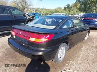 1997 Saturn SC z VIN 1G8ZE1283VZ163658, wystawiony jako IAAI lot #40494467 z przebiegiem 111 701 mil mil oraz . Historia ofert i sprzedaży dostępna na DreamBid. Obrazek 4.
