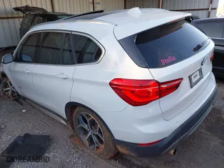 2018 BMW X1 xDrive28i with VIN WBXHT3C32J5K29627, listed as a IAAI auction lot 40995212 with 64,162 mi miles. Bid and sale history available at carsss.com. Image 3.