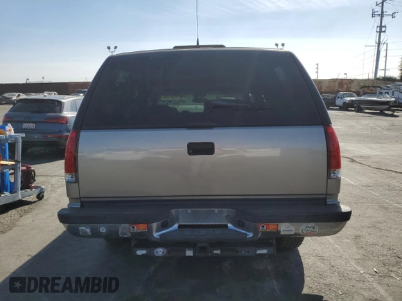 1999 GMC Yukon with VIN 1GKEC13R9XJ704929, listed as a Copart auction lot 89097295 with 87,478 mi miles and Salvage Title. Bid and sale history available at carsss.com. Image 6.
