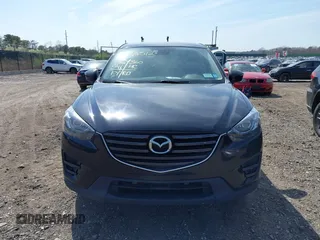 2016 Mazda CX-5 Grand Touring with VIN JM3KE4DY8G0639570, listed as a IAAI auction lot 42098512 with 126,541 mi miles and . Bid and sale history available at carsss.com. Image 12.
