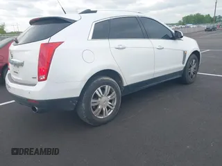 2014 Cadillac SRX Luxury Collection with VIN 3GYFNBE36ES519705, listed as a IAAI auction lot 42069288 with 211,632 mi miles and . Bid and sale history available at carsss.com. Image 4.