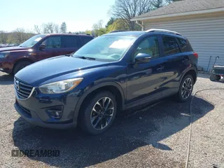 2016 Mazda CX-5 Grand Touring with VIN JM3KE4DY5G0681369, listed as a IAAI auction lot 42102805 with 128,182 mi miles and . Bid and sale history available at DreamBid. Image 18.