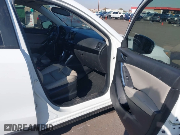 2014 Mazda CX-5 Grand Touring with VIN JM3KE4DY4E0375809, listed as a IAAI auction lot 41468078 with 151,226 mi miles. Bid and sale history available at carsss.com. Image 5.