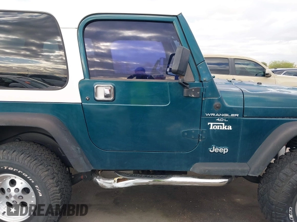 1998 Jeep Wrangler Sport with VIN 1J4FY19S7WP787679, listed as a IAAI auction lot 41764883 with 134,144 mi miles. Bid and sale history available at carsss.com. Image 13.