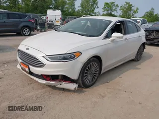 2017 Ford Fusion Titanium z VIN 3FA6P0K92HR396113, wystawiony jako IAAI lot #42402969 z przebiegiem 185 620 mil mil oraz . Historia ofert i sprzedaży dostępna na DreamBid. Obrazek 2.