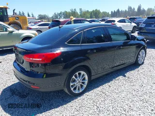 2018 Ford Focus SE z VIN 1FADP3FE5JL279274, wystawiony jako IAAI lot #42626587 z przebiegiem 92 110 mil mil oraz . Historia ofert i sprzedaży dostępna na DreamBid. Obrazek 4.
