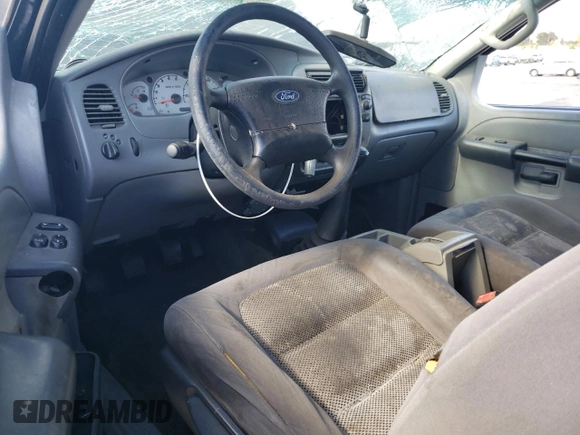 2003 Ford Explorer Sport XLS z VIN 1FMYU60E93UC12832, wystawiony jako Copart lot #71596394 z przebiegiem 197 215 mil mil oraz Szkody całkowita. Historia ofert i sprzedaży dostępna na DreamBid. Obrazek 8.