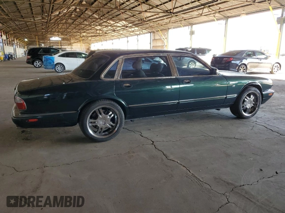 1999 Jaguar XJ with VIN SAJKX6046XC855872, listed as a Copart auction lot 47060465 with 65,286 mi miles and Clean title. Bid and sale history available at DreamBid. Image 3.