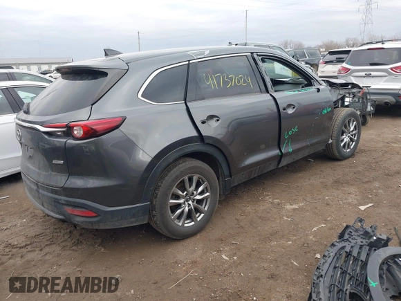 2018 Mazda CX-9 Touring with VIN JM3TCBCY3J0212479, listed as a IAAI auction lot 41737024 with 128,552 mi miles and . Bid and sale history available at DreamBid. Image 4.